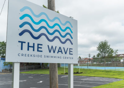 The Wave swimming center at Creekside entrance sign