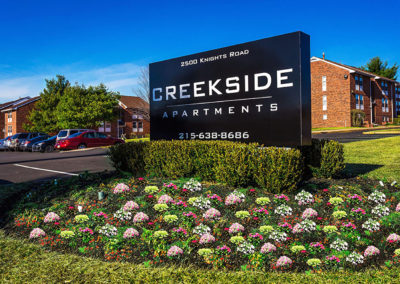 Entrance sign at Creekside Apartments