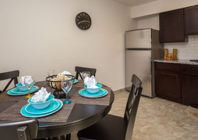 Kitchen and dining area at Creekside Apartments in Bensalem