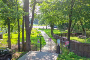 Parking lot view of the outdoor picnic areas at Creekside Apartments