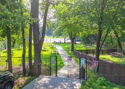 Parking lot view of the outdoor picnic areas at Creekside Apartments