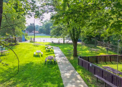 Side view of the outdoor picnic area at Creekside apartment complex