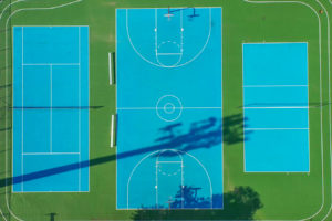 Outdoor recreation at Creekside Apartments including basketball and tennis courts