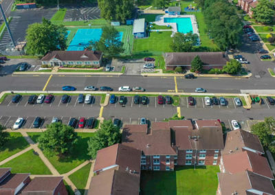 View of parking lots and outdoor recreation for the community members at Creekside Apartments